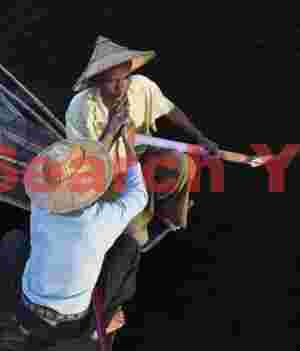 Fishermen lighting a cheroot