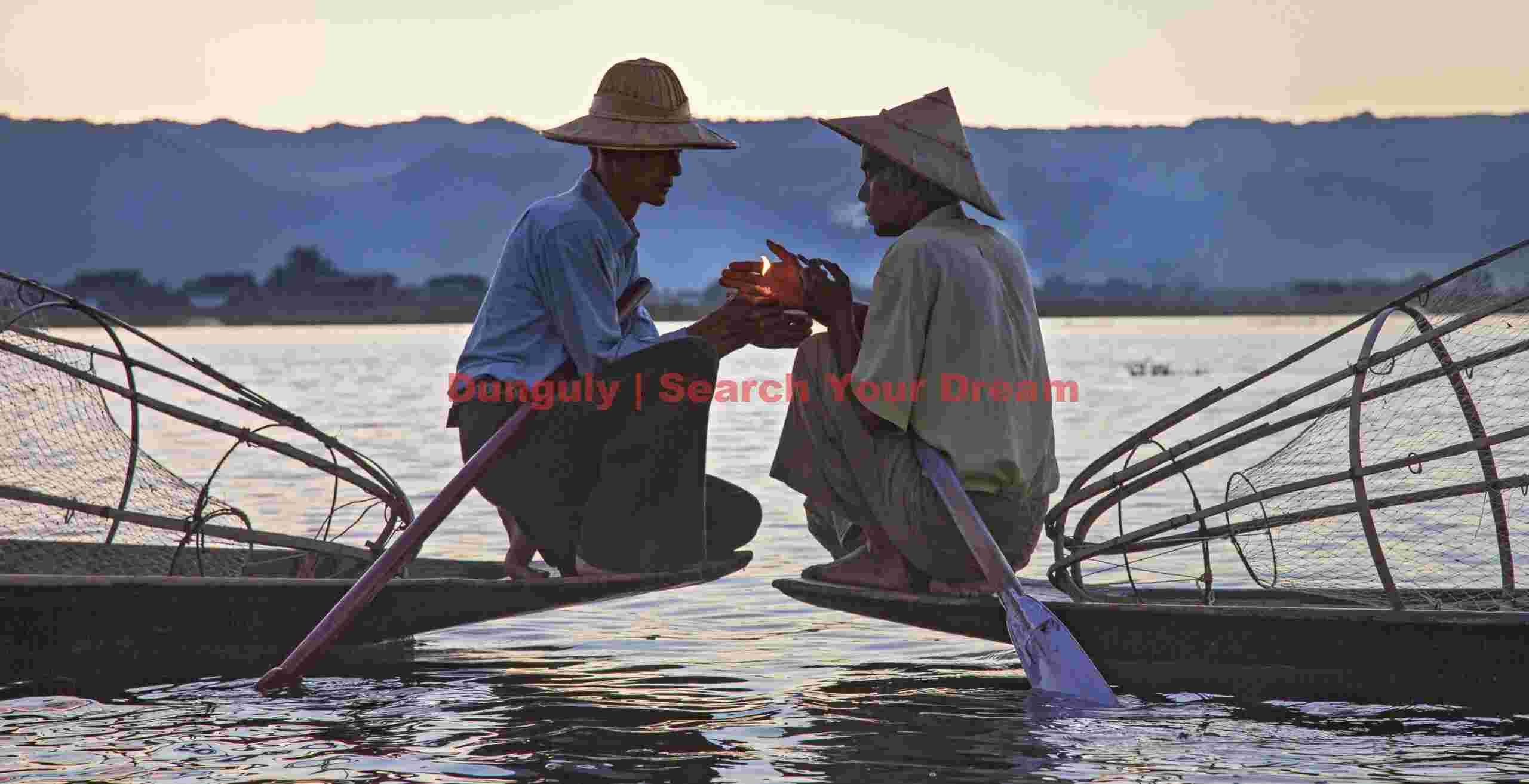 Fishermen sharing a light
