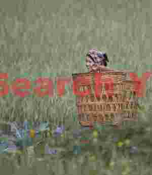 Girl in fields with baskets