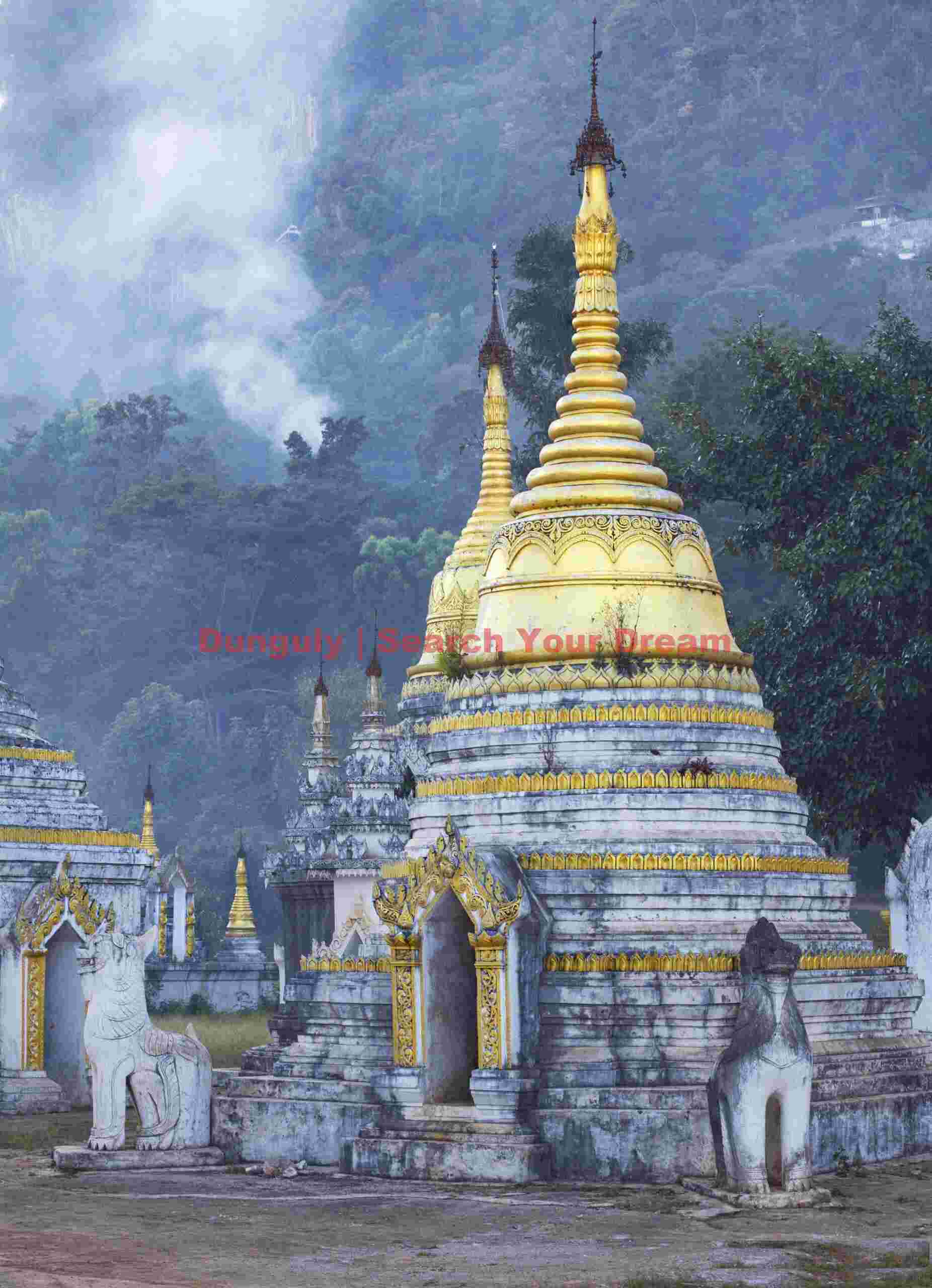 Golden stupa against smoke from hill fires