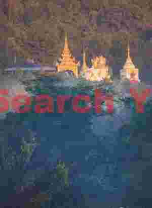 Golden stupas on the hillside catching first sunlight