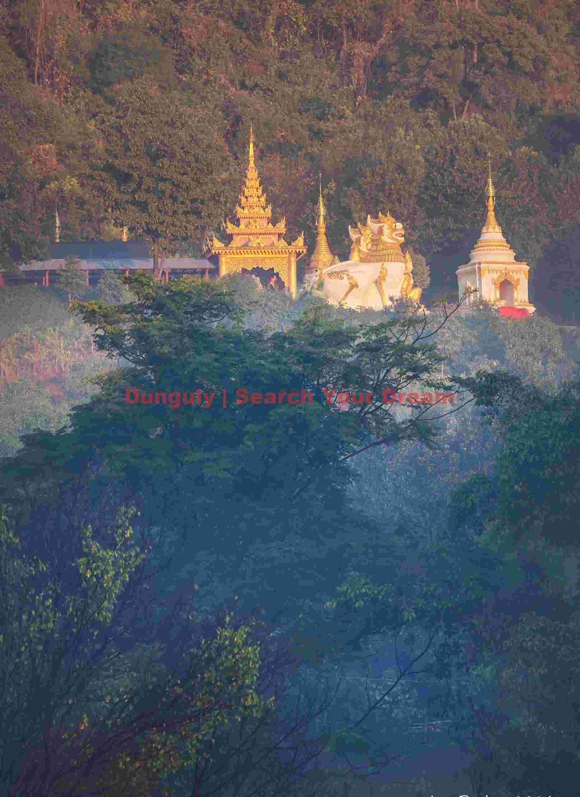 Golden stupas on the hillside catching first sunlight