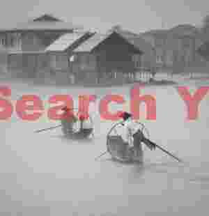 Leg-rowing fishermen in mist