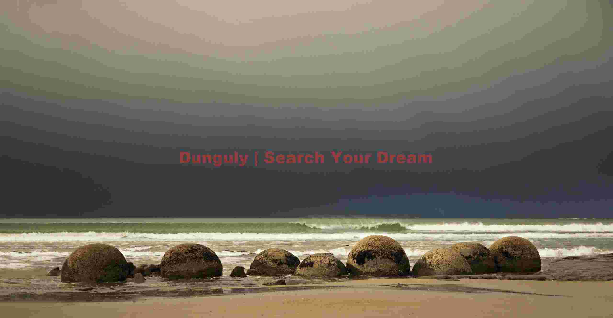 Moeraki boulders line-up under forbidding storm cloud