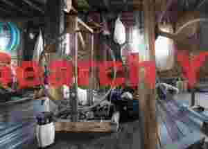 Old lady spinning silk