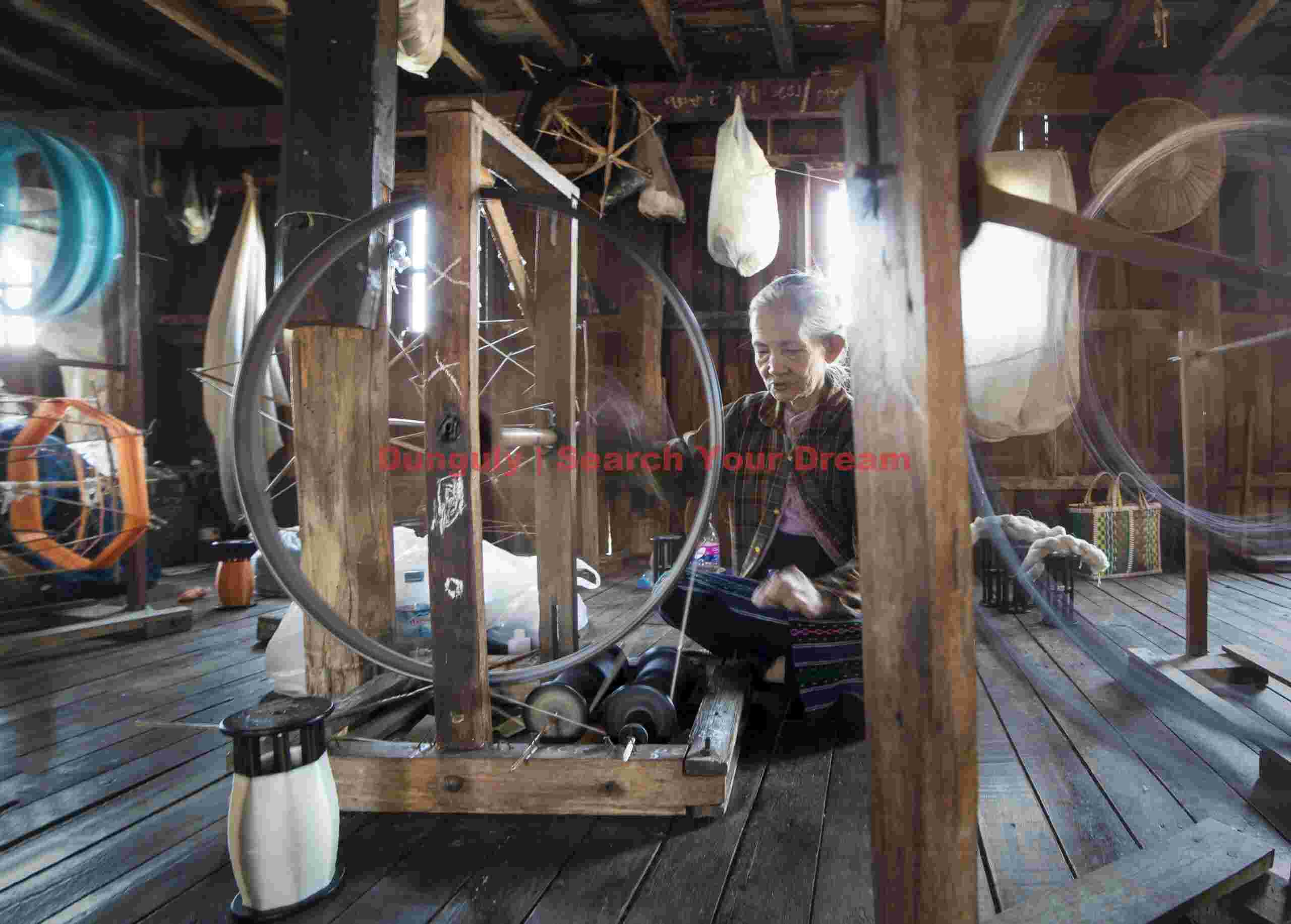 Old lady spinning silk