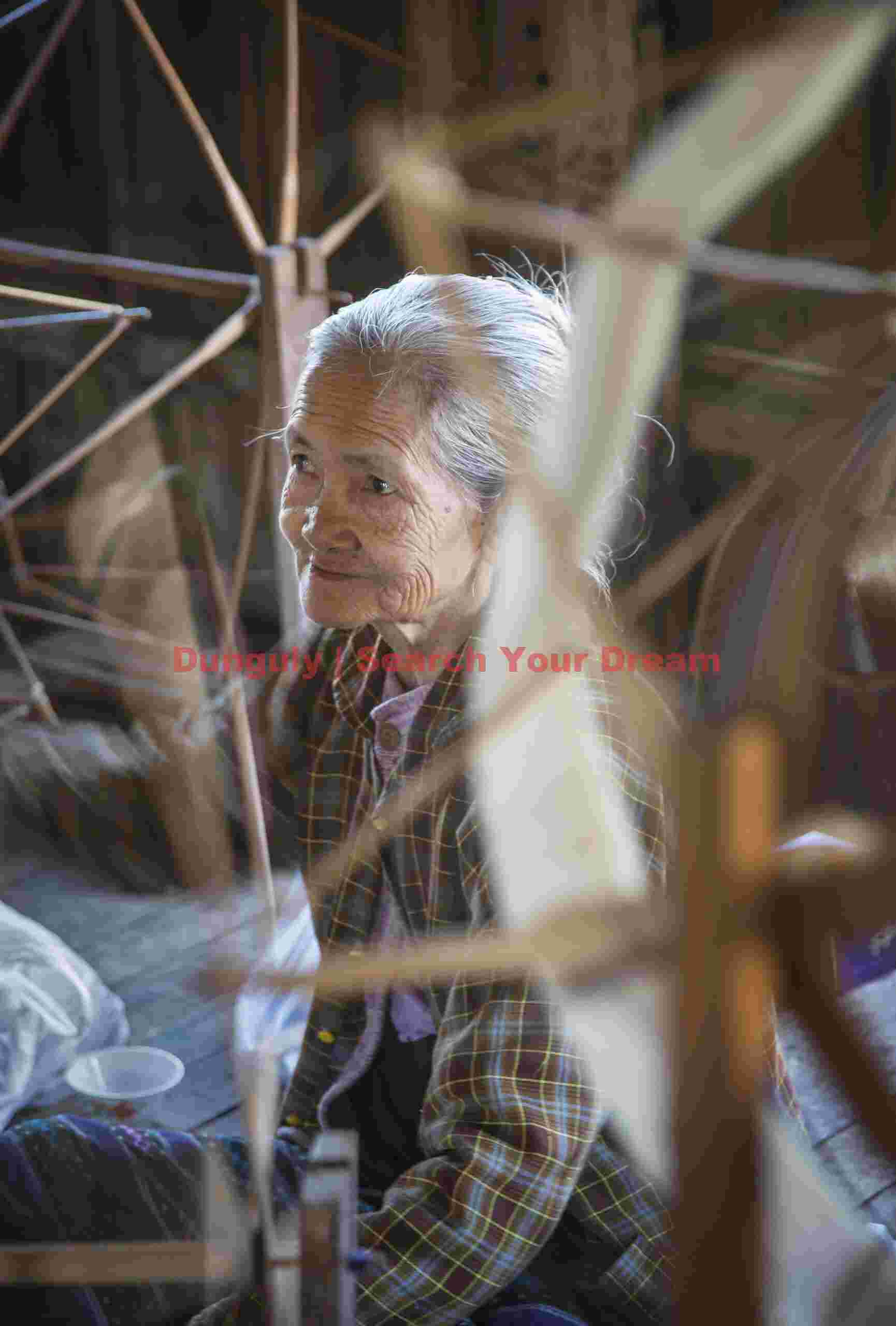 Old woman spinning