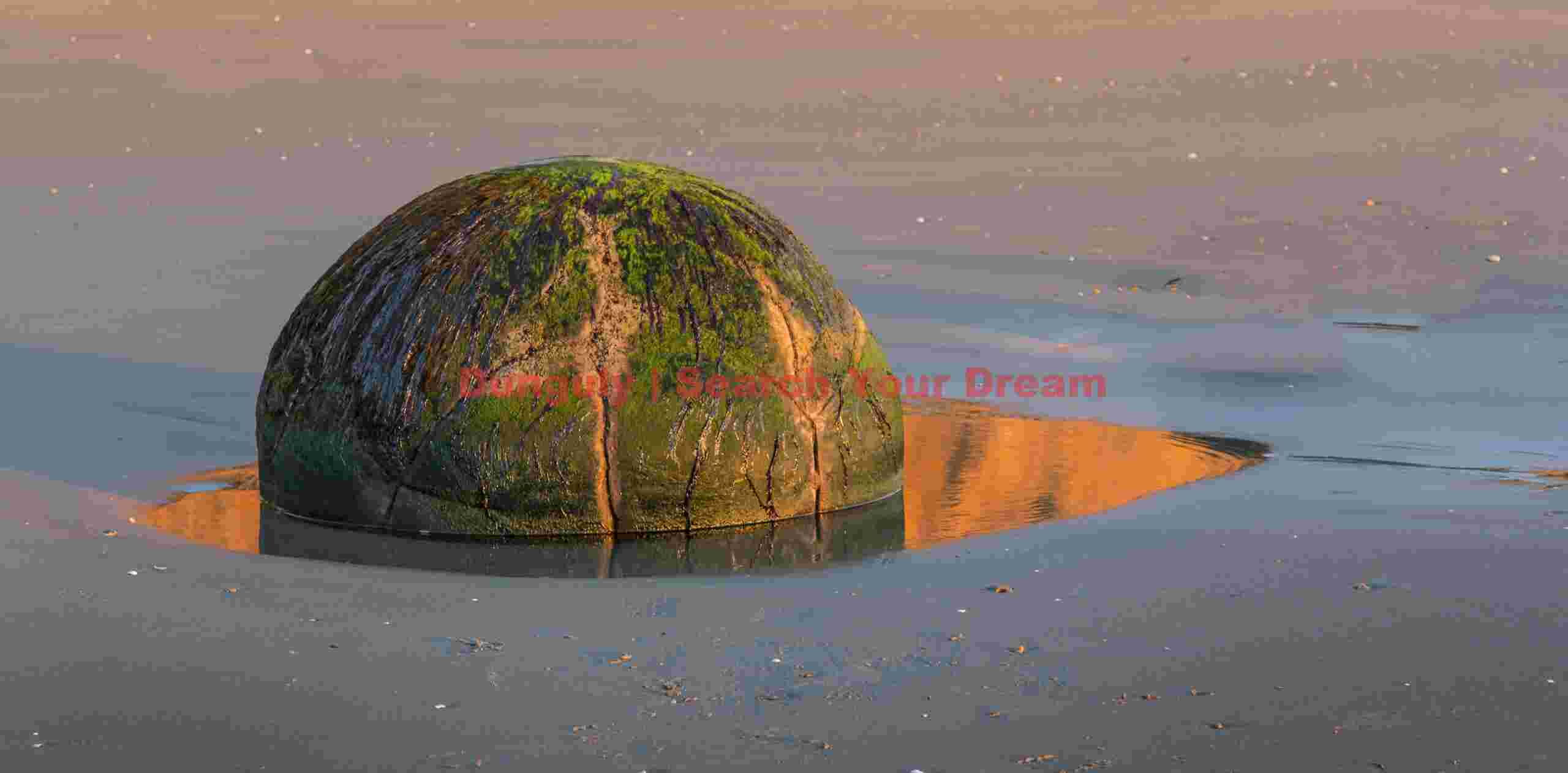 Orange orb and reflection at sunrise