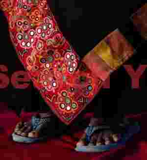 Red embroidery at foot level