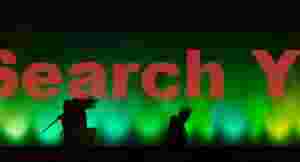 Silhouettes against floodlit wall - Museum of Art, Hong Kong