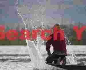 Thwacking the water to bring up fish